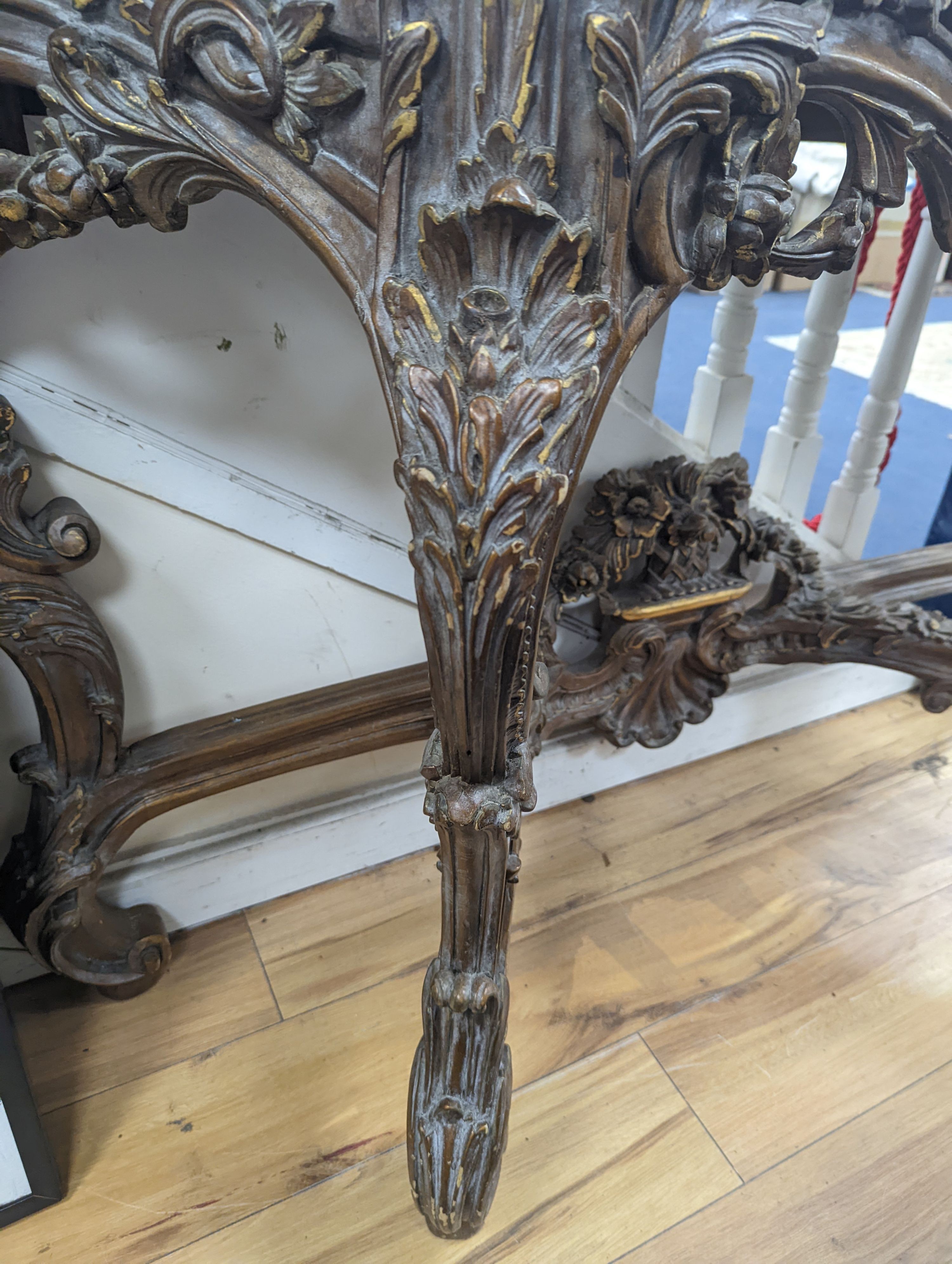 An 18th century style carved giltwood serpentine console table with serpentine marble top, width 140cm, depth 44cm, height 95cm